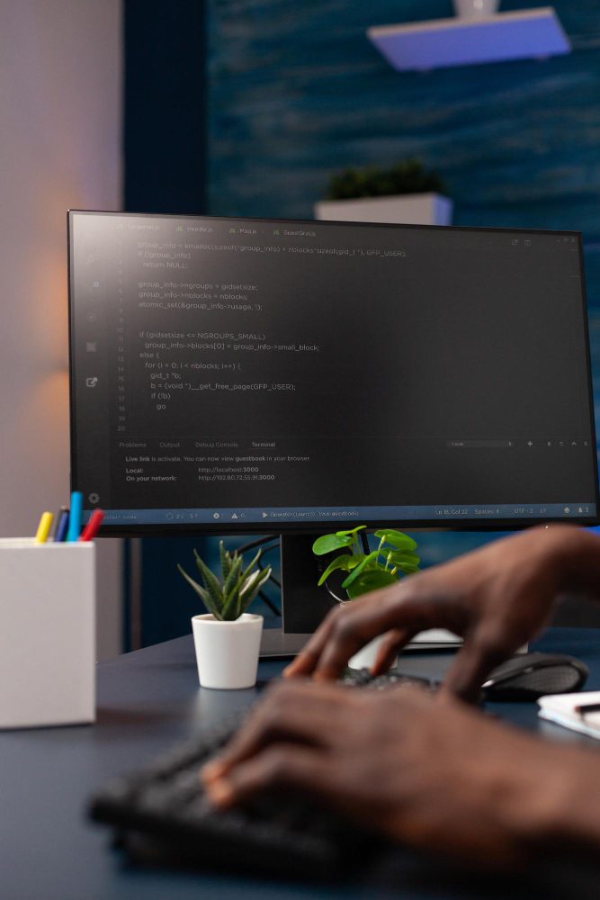 Developer building a fast, properly-coded small business website at a desk workspace