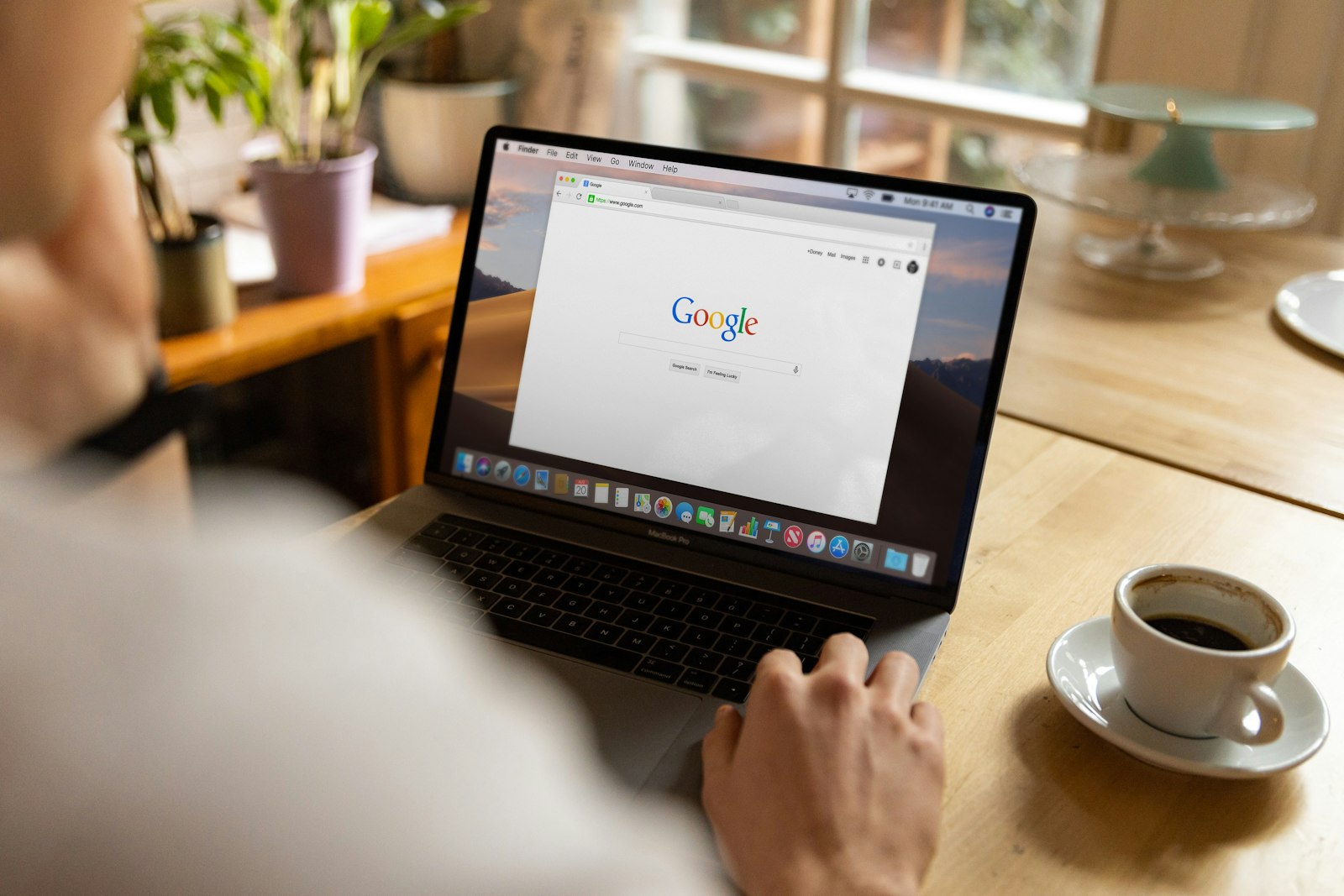 Person using Google AI Mode conversational search on smartphone, small business SEO strategy 2026